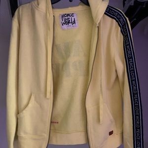 peace love world yellow zip up